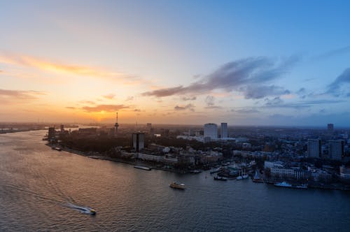 amsterdam, arkadan aydınlatılmış, bulutlar içeren Ücretsiz stok fotoğraf