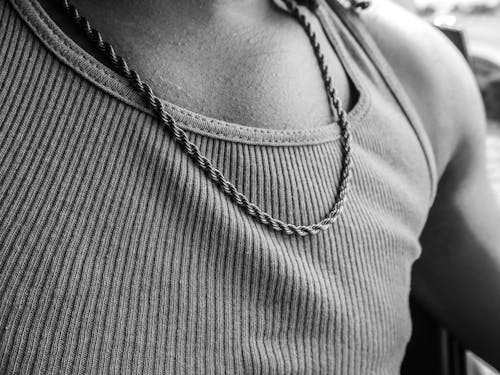 Monochrome Photo of Person Wearing Necklace