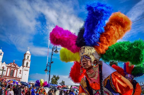 Man Wearing Colorful Costume on a Parade 