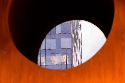 Glass Modern Building Seen Through a Hole 