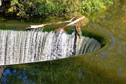 A waterfall is seen in the water