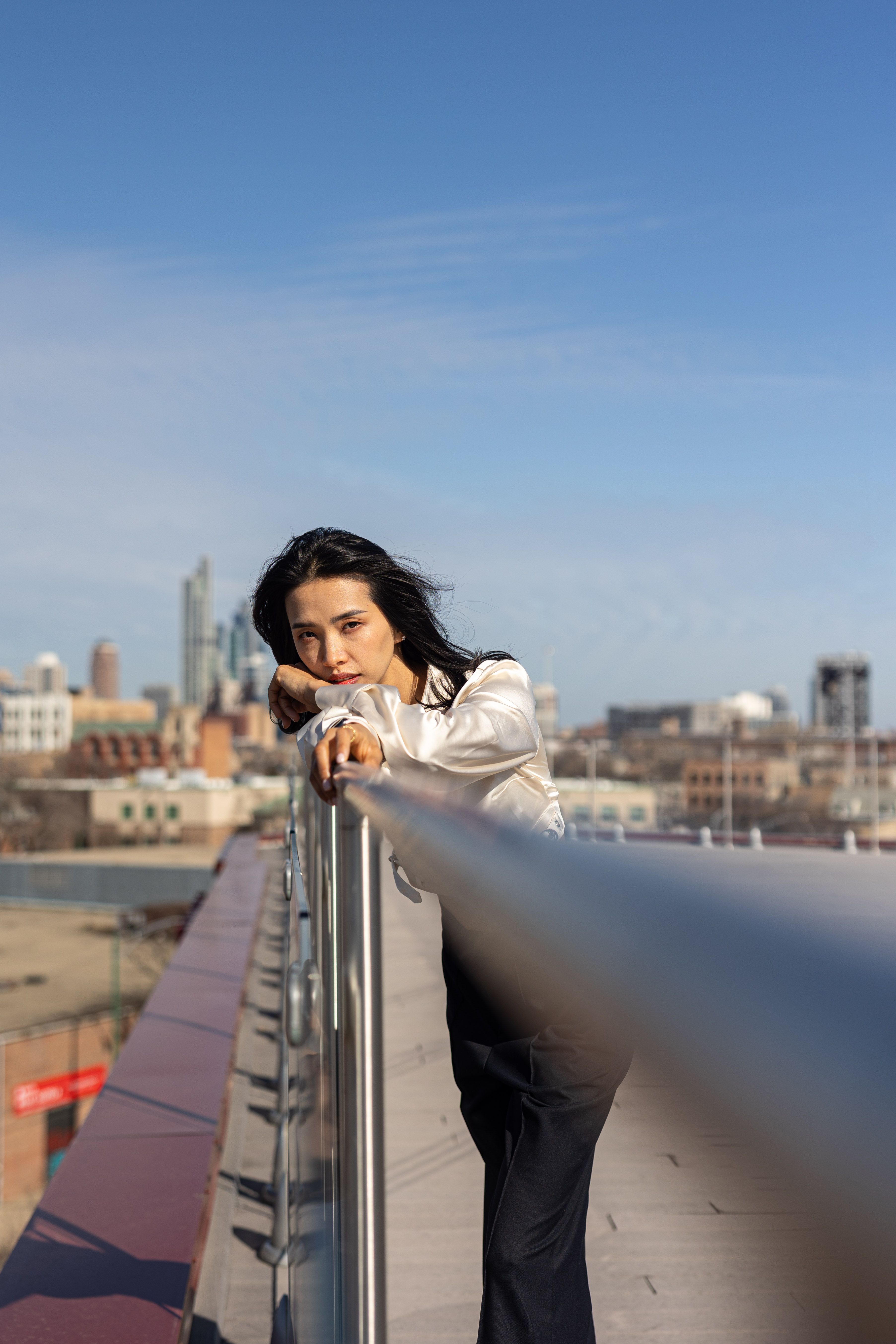 Woman Standing and Leaning on Railing · Free Stock Photo