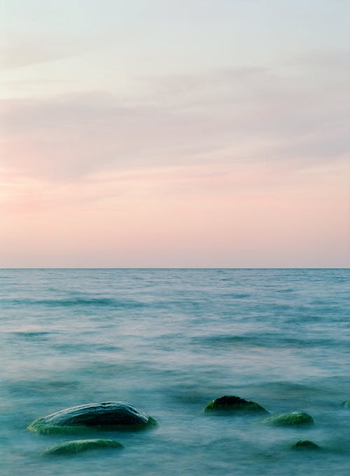 Foto profissional grátis de água, alvorecer, beira-mar