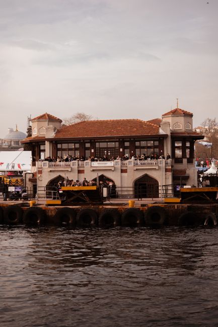 Beautiful view of Üsküdar Pier in Istanbul with historical architecture by the sea.
