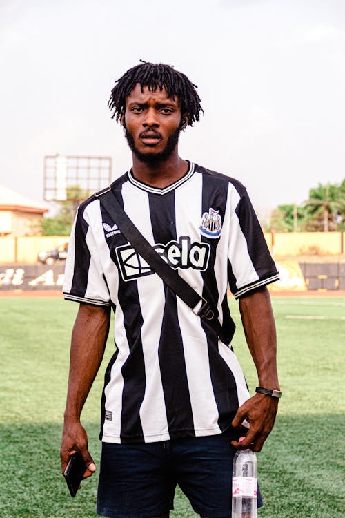 A man in a black and white soccer jersey
