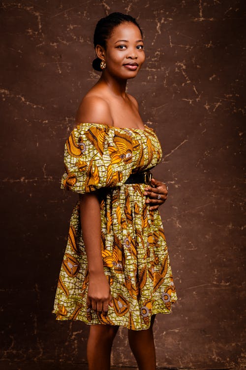 A beautiful african woman in a yellow dress