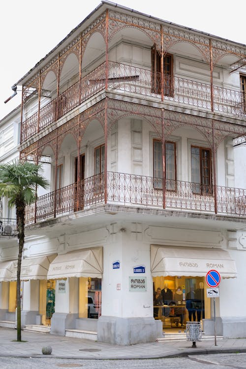 A building with balconies and balconies on the side