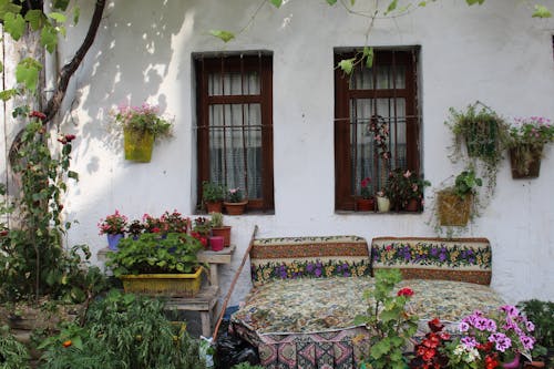 A house with a garden and flowers on the porch