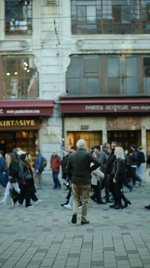 A man walking down a crowded street in istanbul