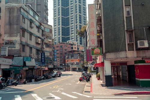 A city street with tall buildings and cars