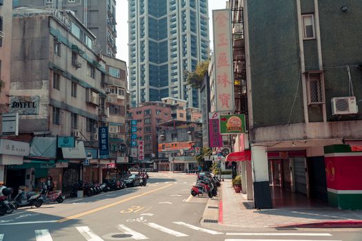 A bustling city street with skyscrapers and vibrant urban life.