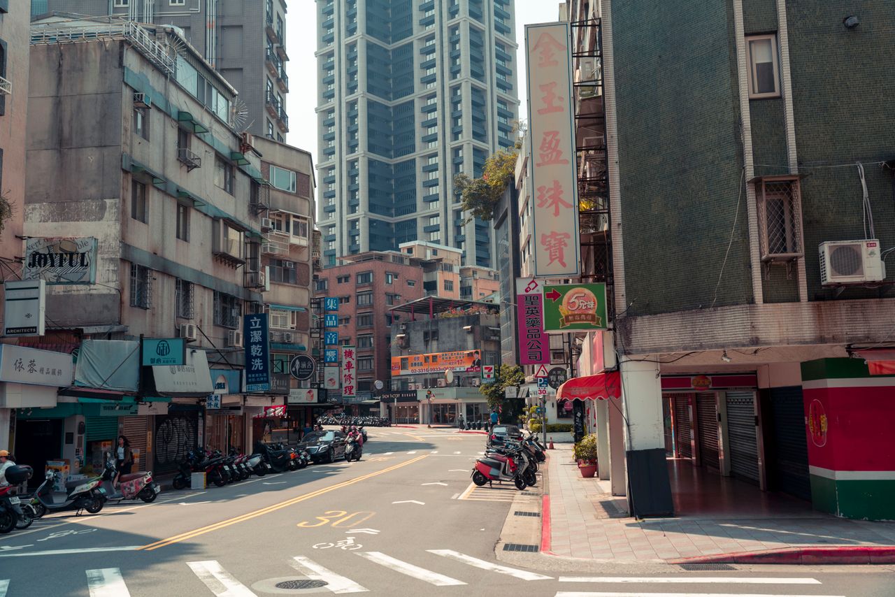 a bustling city street with skyscrapers and vibrant urban life