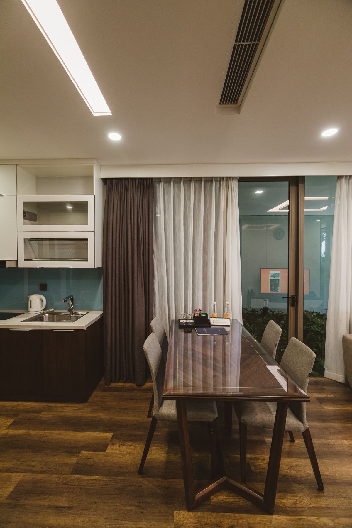Chic small dining area with a wooden table and chairs in a modern apartment