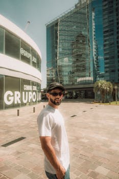Portrait of a man in casual attire with cityscape background in Buenos Aires.