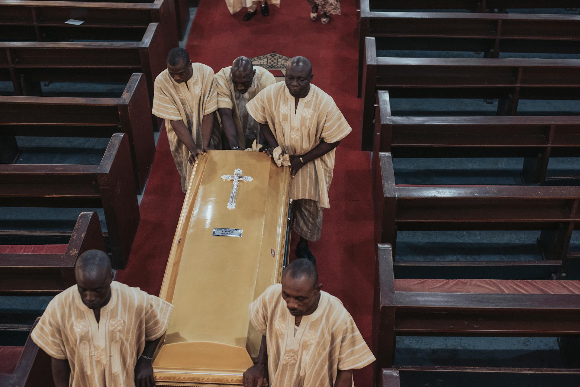 Men Carrying Casket in Funeral at Church