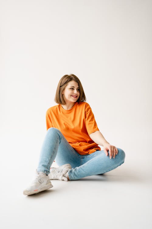Woman in Jeans and Orange T-shirt