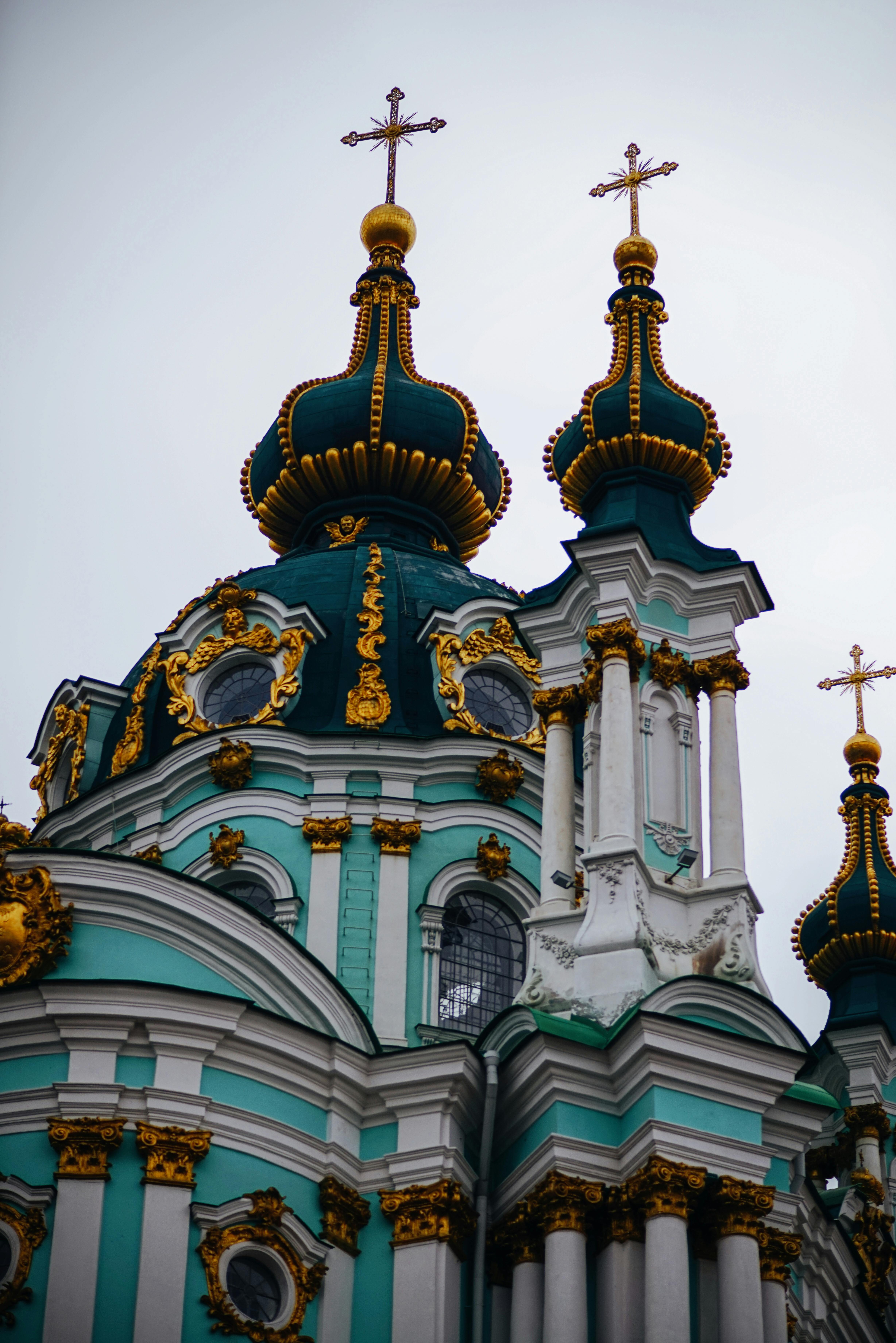 Stunning baroque style of St. Andrew's Church under a cloudy sky.