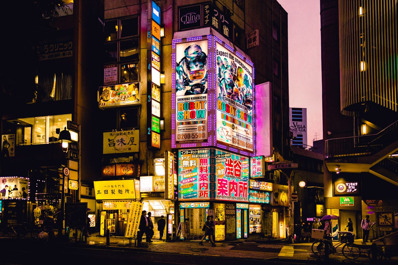 explore the vibrant nightlife of shinjuku tokyo with colorful neon sig