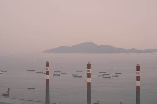 A view of a harbor with smoke coming out of it