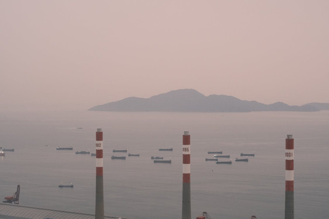 A view of a harbor with smoke coming out of it