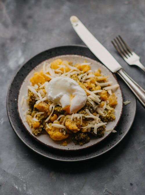 Broccoli and Cauliflower With Egg on Plate