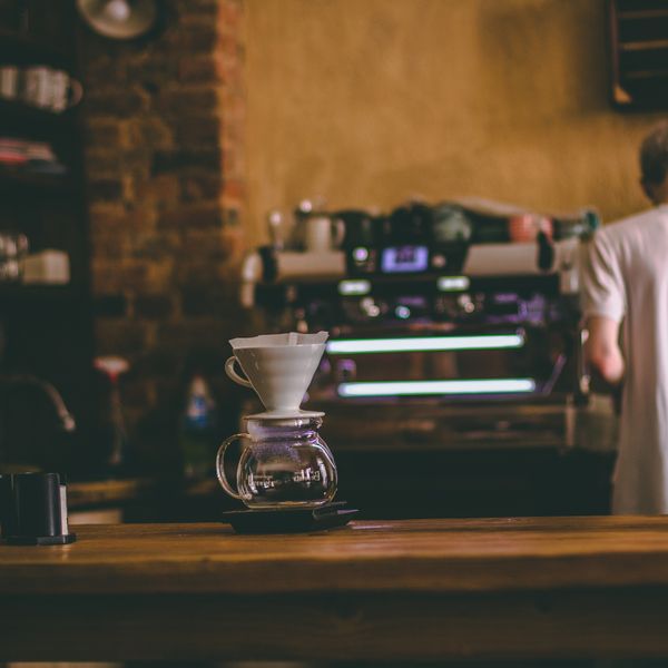 Barista pouring a latte at Munchy's
