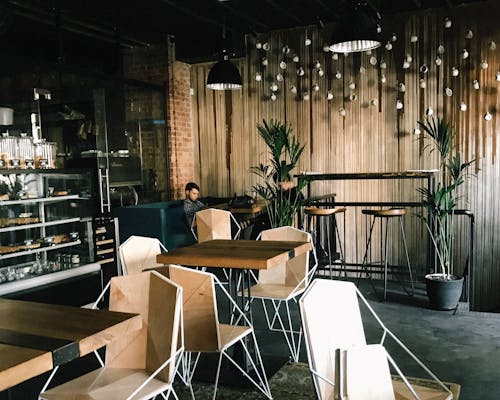 Man Sitting by the Table in Cafe