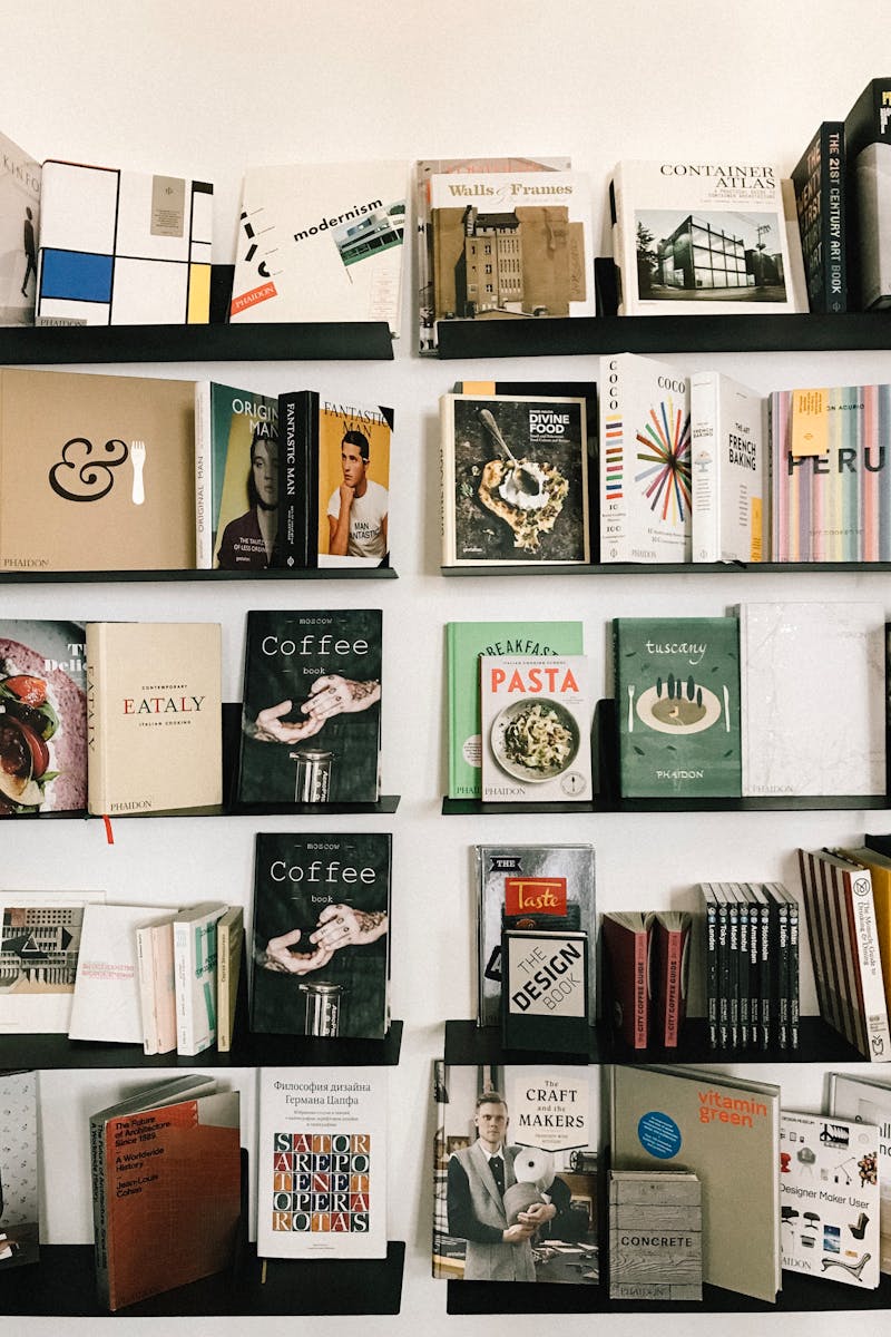 A beautifully curated bookshelf displaying a diverse collection of books in a modern library setting. A beautifully curated bookshelf displaying a diverse collection of books in a modern library setting.