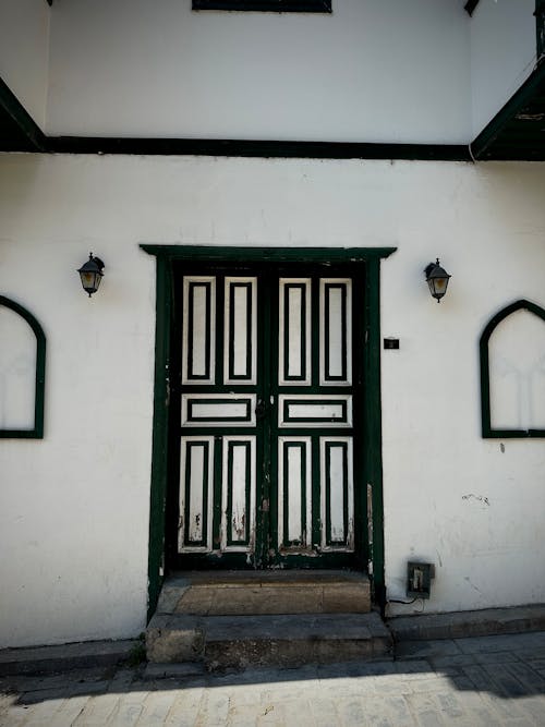 View of Old Door in a White Building 