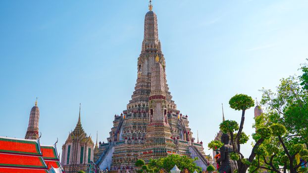 Stunning view of Wat Arun, a prominent Buddhist temple in Bangkok known for its intricate mosaics and towering spire.