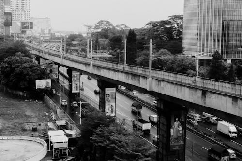 A black and white photo of a highway overpass