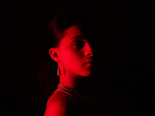 Young woman in red lighting 