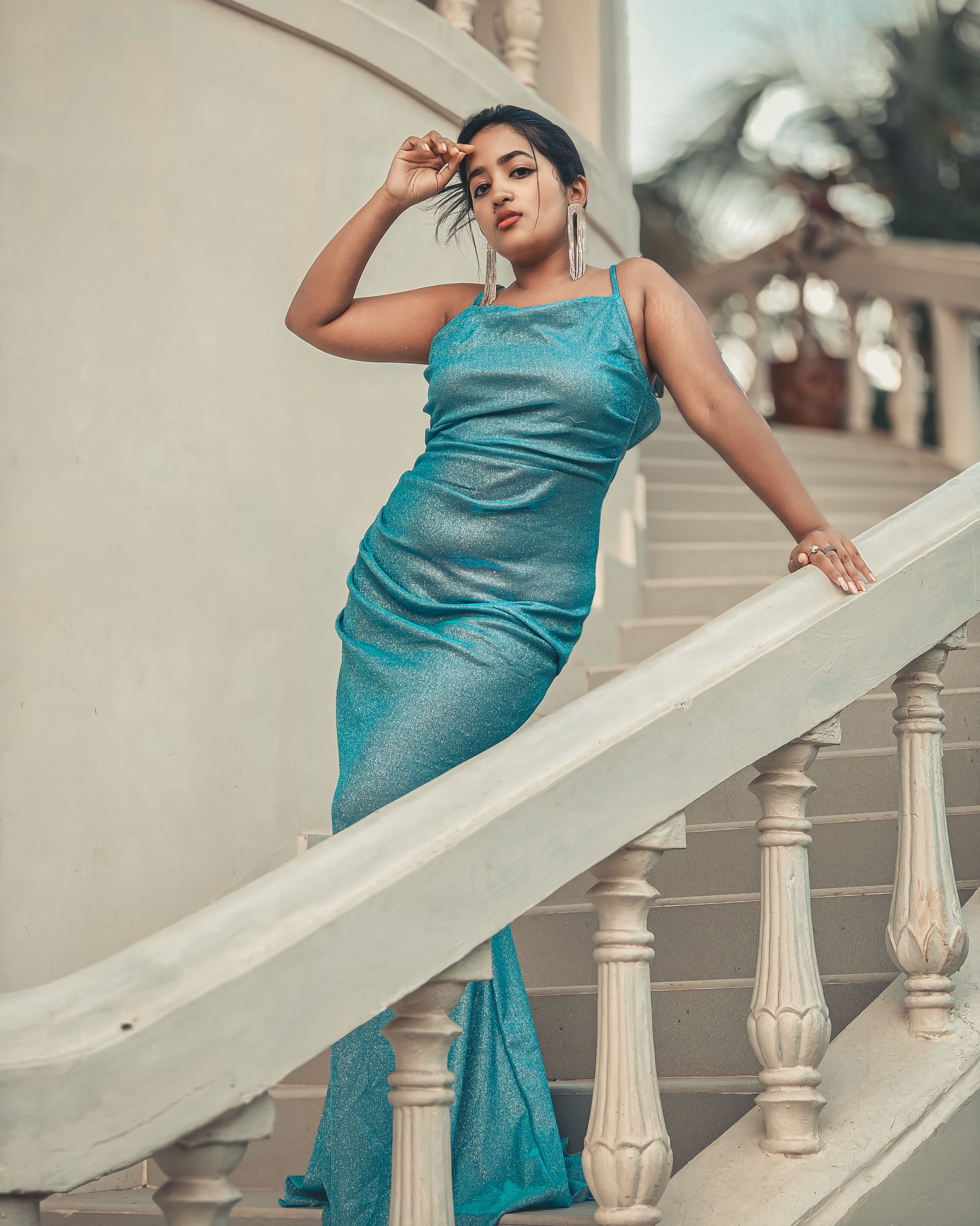Woman in Blue Dress Standing on Stairs · Free Stock Photo