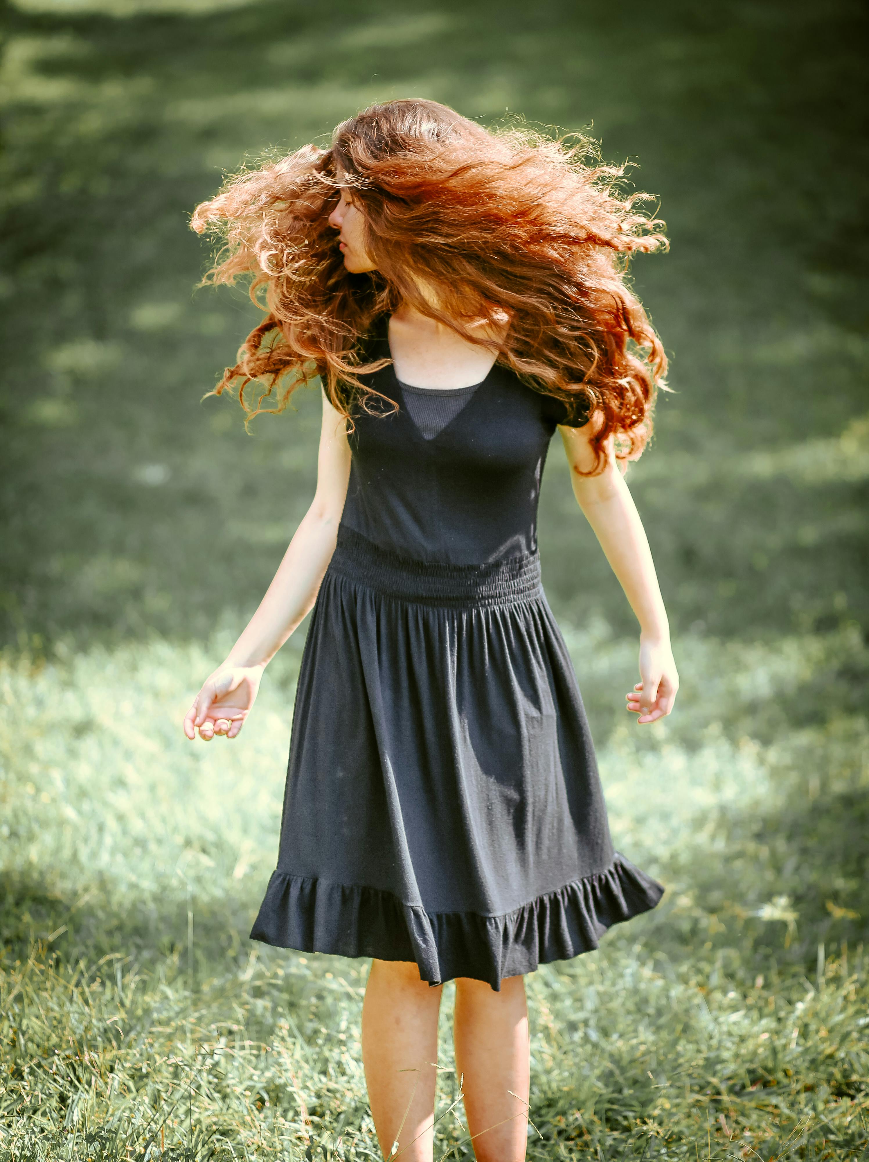 Back View Photo of Woman Flipping Her Hair While Looking at Lake · Free ...