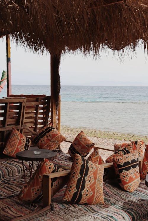 Table and Cushions under a Beach Canopy