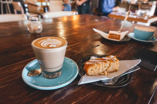 Free Espresso on Teal Saucer Beside Baked Cake Stock Photo