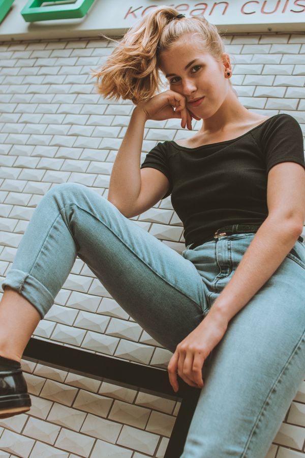 Woman in a striped tank top with jeans