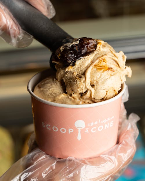 Close-up of Putting Ice Cream Scoops in Paper Cup