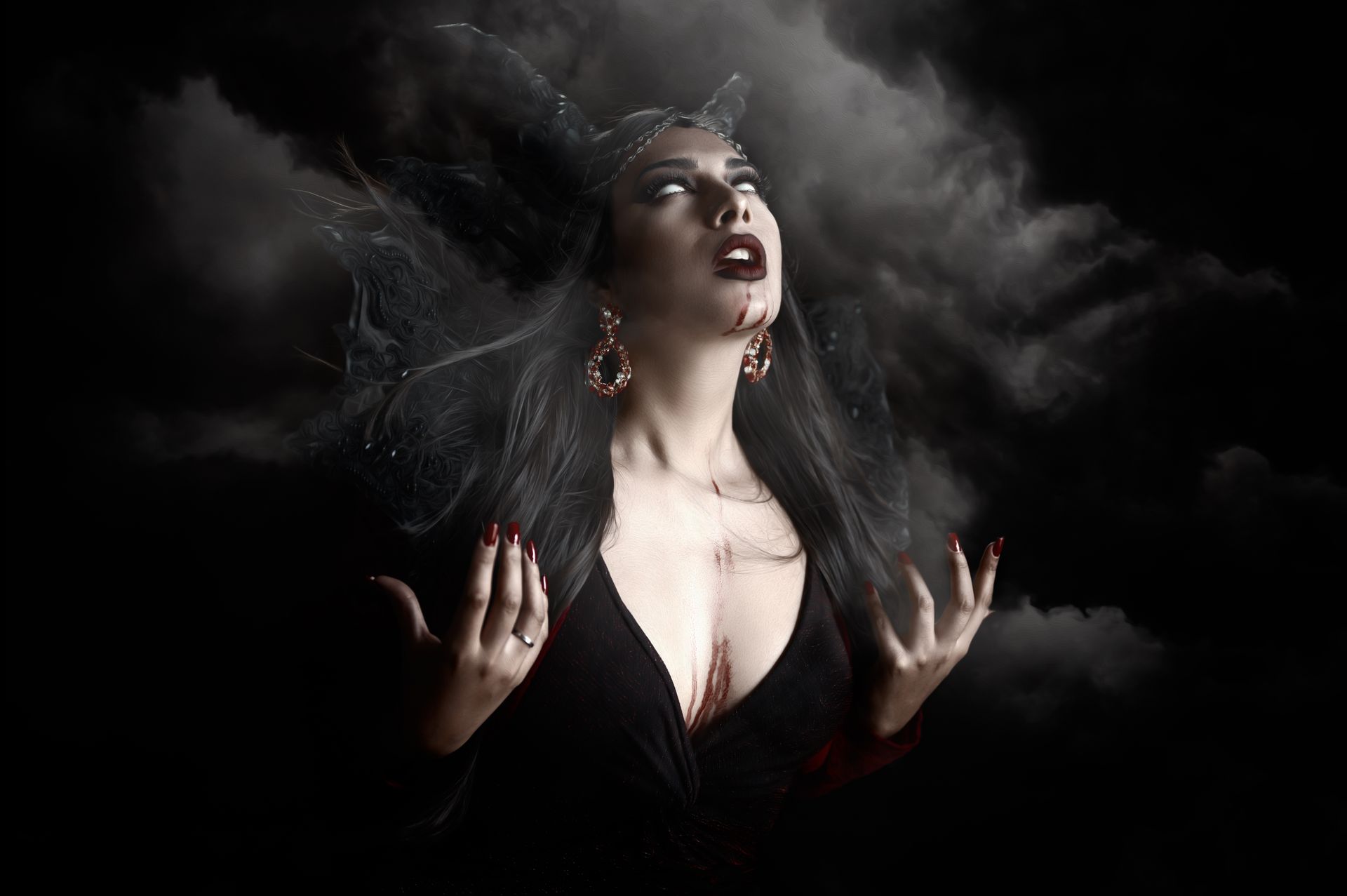 Woman in Eerie Vampire Costume in Smoke on Black Background