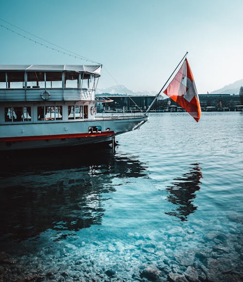 White and Red Flag on Boat