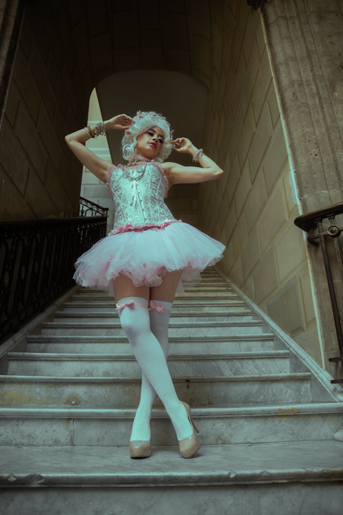 Free Ballet dancer in stylish vintage attire posed on a staircase in Ciudad de México, CDMX. Stock Photo
