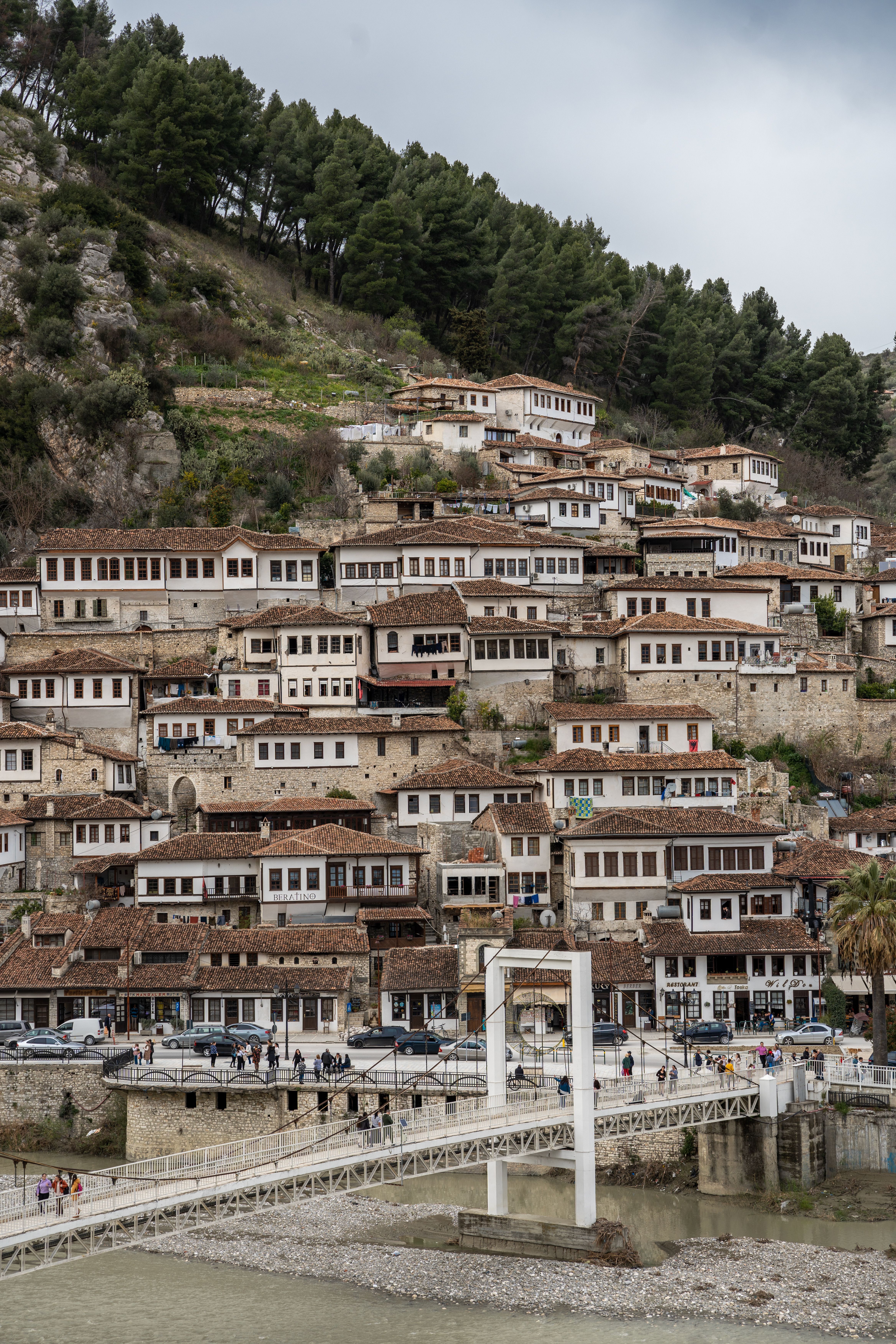 Explore the historic architecture of Berat, Albania's charming hillside town.