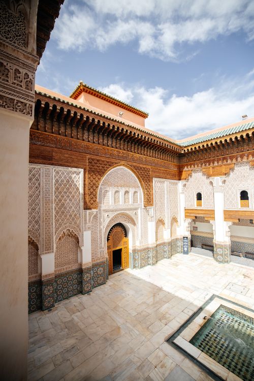 Free Explore the intricate Islamic architecture of Ben Youssef Madrasa in Marrakesh, Morocco. Stock Photo
