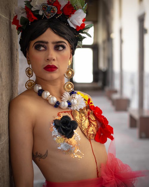 A woman in a frida costume with flowers on her chest
