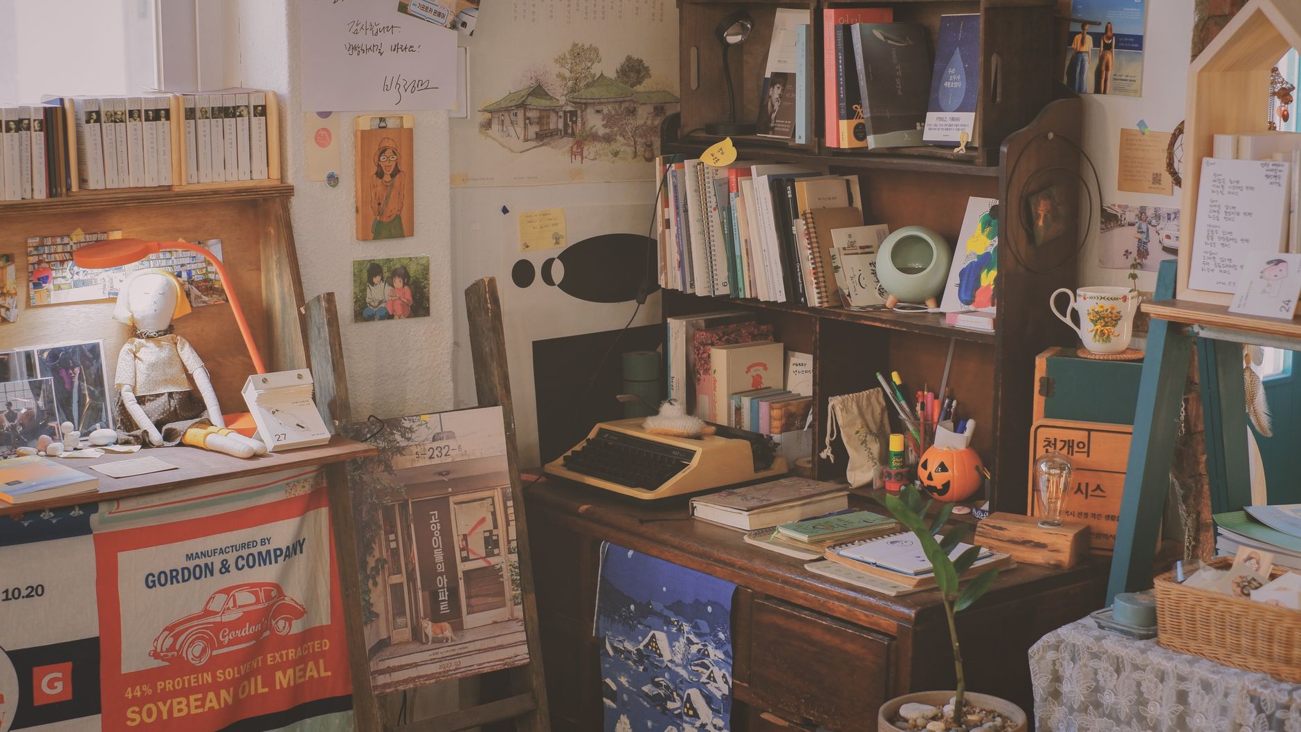 A warm, cluttered study filled with books, a typewriter, and vintage decor creating a cozy ambiance.