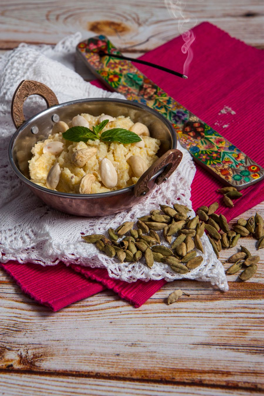 Halwa with almonds and cardamom in a rustic bowl