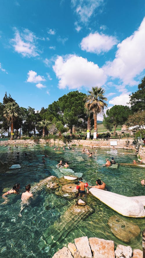 Free People Swimming in a Tropical Pool Stock Photo