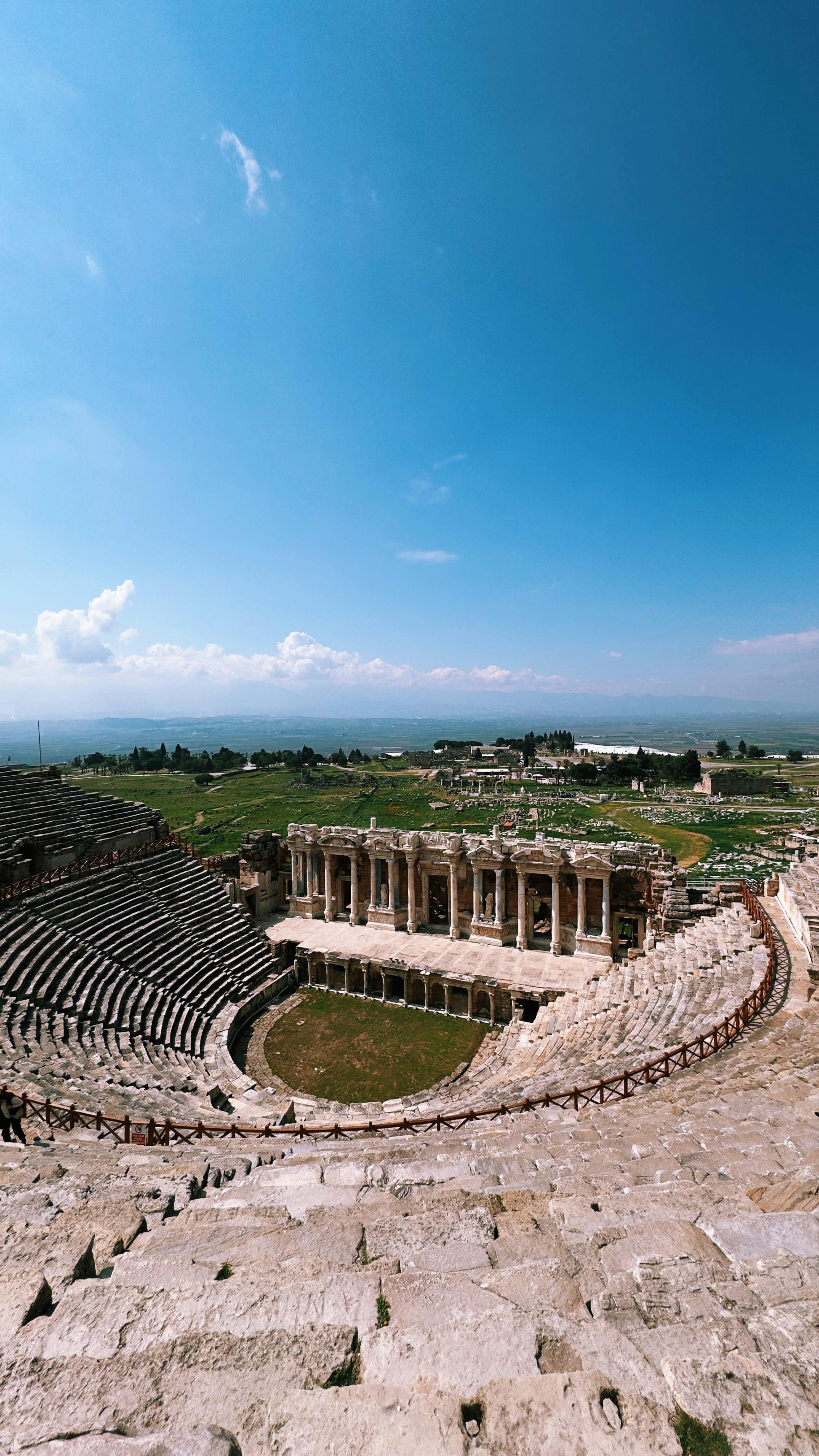 Free Explore the captivating ancient theater ruins in Pamukkale, Türkiye, under a clear, blue sky. Stock Photo