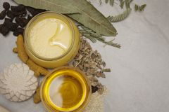 Flat lay of natural ingredients, herbs, and honey jars showcasing a healthy lifestyle and wellness theme.