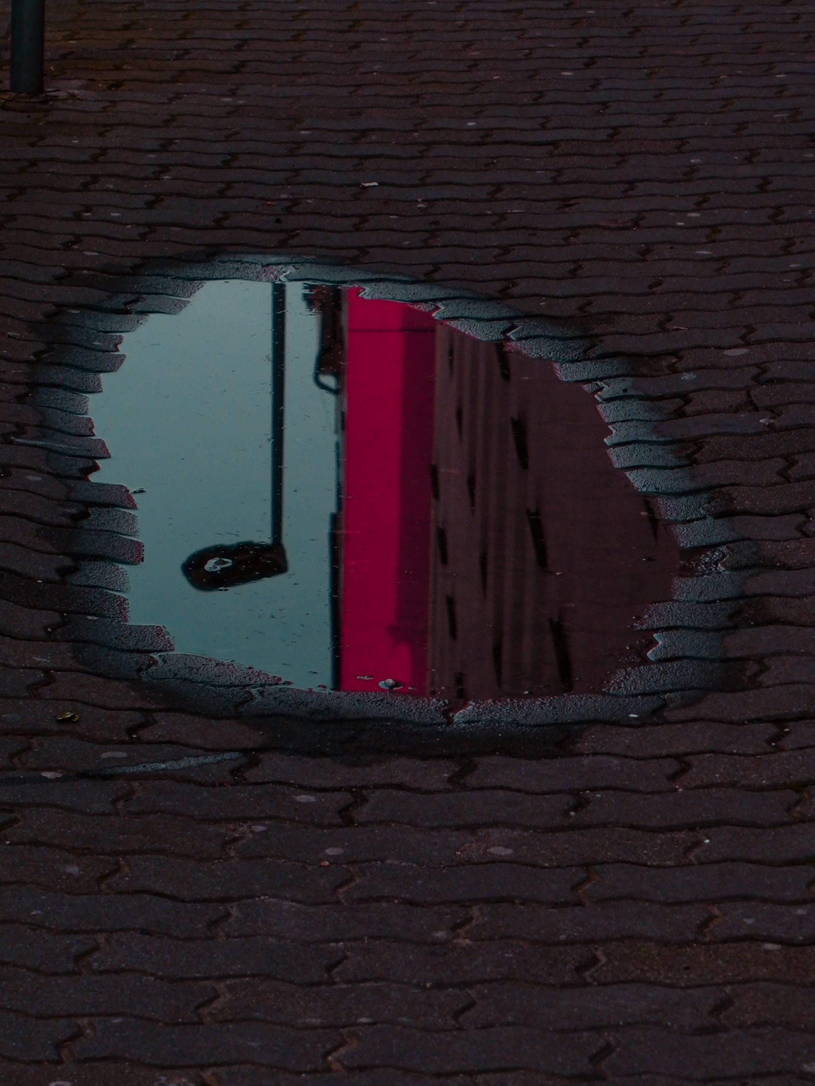 Reflection of Building in Puddle · Free Stock Photo